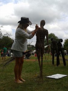 Sara Holmes sculpting with willow